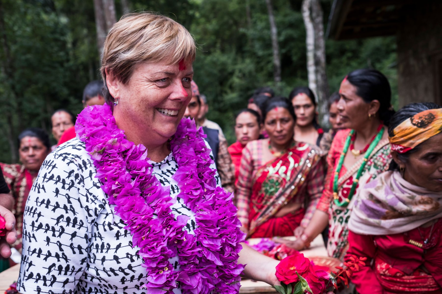 Cathy Reade Director of Public Affairs and Communication at The Crawford Fund is greeted by members of the Chaubas Community Forest Users Group. The group is predominantly made up of women and they are highly engaged in the silvicultural management of community forests and have been farming cardamom in Fagar Khola community forest for the past two years. Cardamom is a high value crop that requires little maintenance once it's been planted and leads to additional income for the female farmers.