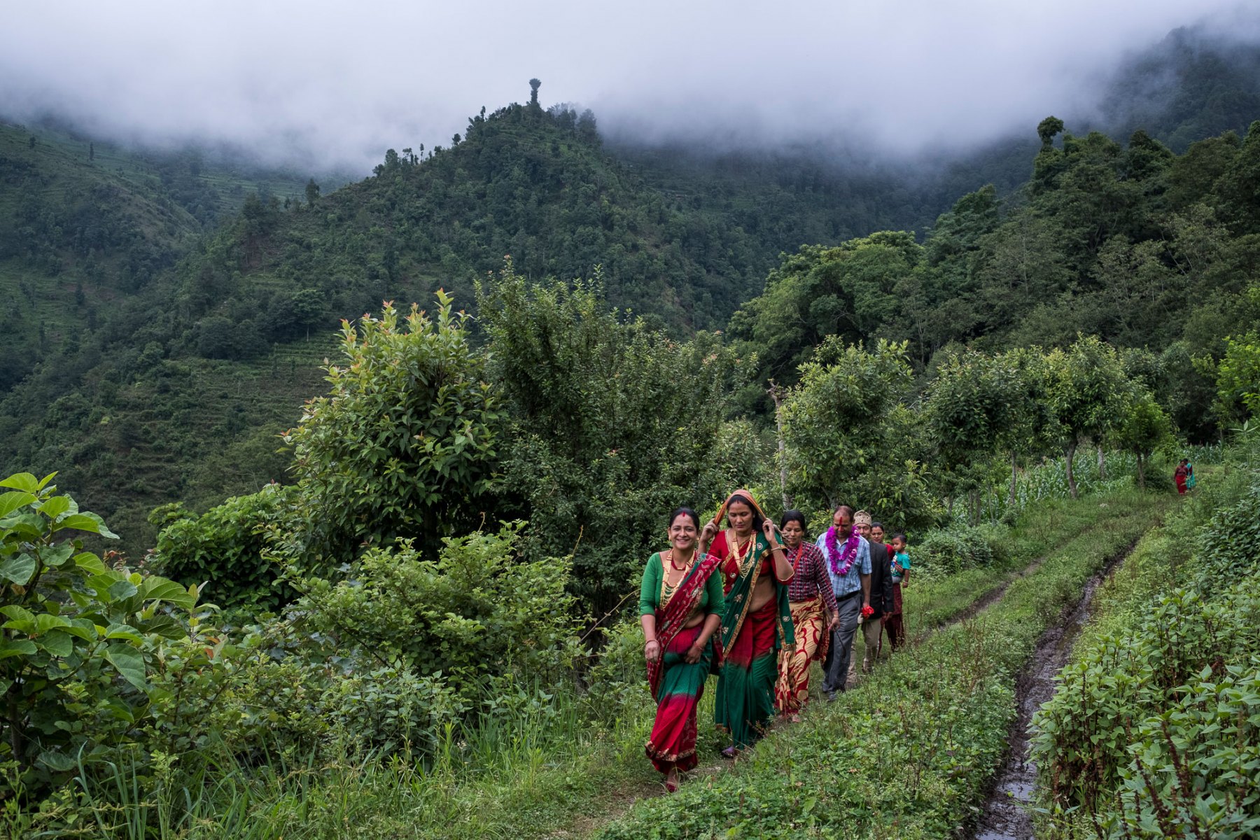 Female farmers from the Chaubas Community Forest Users Group walk out of  the Khola community forest. Sushila Kumar (not pictured) is chairwoman of the Chaubas Community Forest Users Group. The groups of women are highly engaged in the silvicultural management of community forests and have been farming cardamom in Fagar Khola community forest for the past two years. Cardamom is a high value crop that requires little maintenance once it's been planted and leads to additional income for the female farmers.