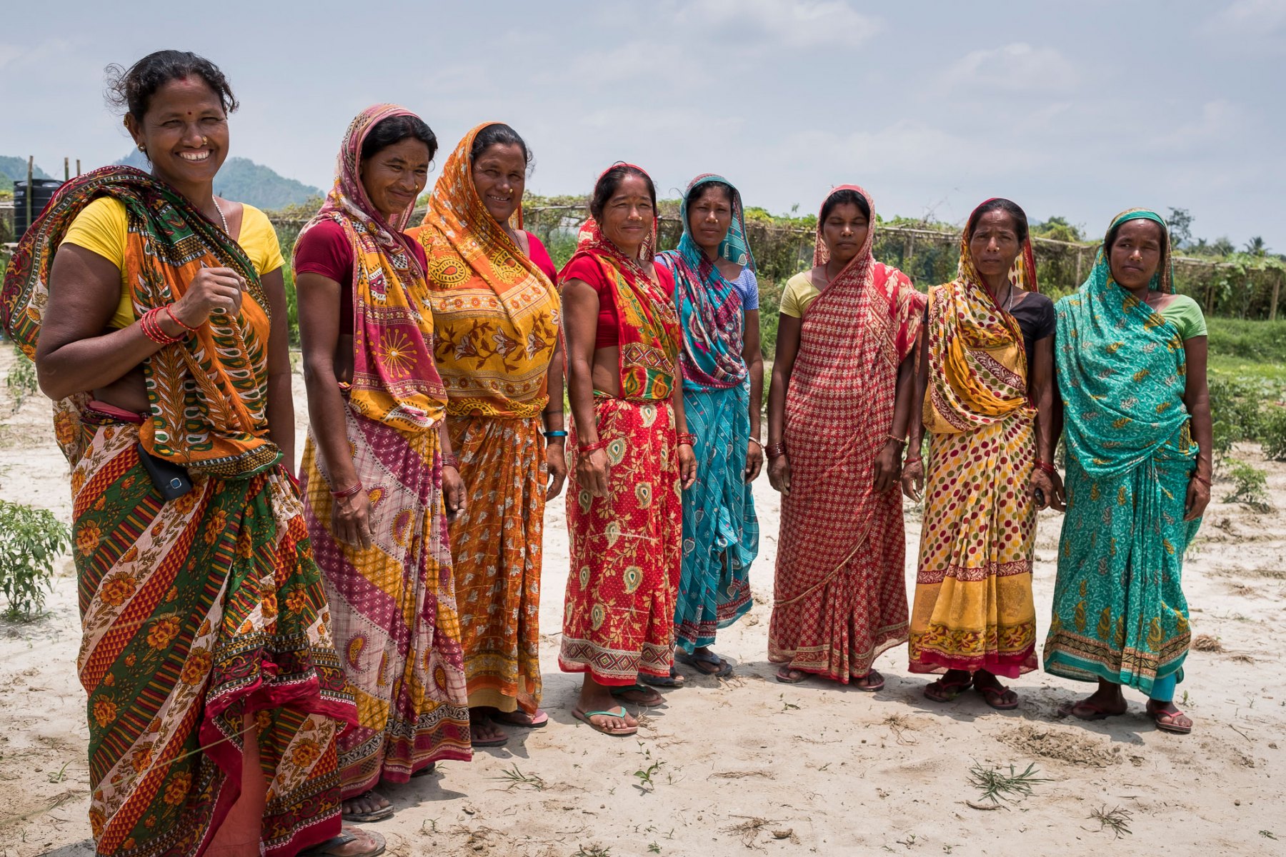 Janaki Devi (left) and other farmers from her group stand for a group photo. Janaki lives in Kanakpatti village, Saptari district, Terai region of Nepal. Janaki Devi is from the indigenous (Adavasi) Choudary group who traditionally are very poor and socially marginalized, she only had attended school for three years. The ACIAR project works with landless, untenured farmers like Janaki Devi and supports them to form groups, approach a landlord who doesn’t use land in the dry season, collectively rent it and have access over the dry season using groundwater and sharing labour. Janaki is the president of her group and sells much of her produce at the local twice-weekly market. This extra money Janaki Devi now makes she uses to help support her son who is currently studying engineering at college.