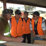 Participants with Robert Torenius at his sawmilldiscussing mill supply chain interactions