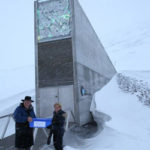 The Crop Trust’s Marie Haga and Board Member Tim Fischer carry Australian seeds into the seed vault