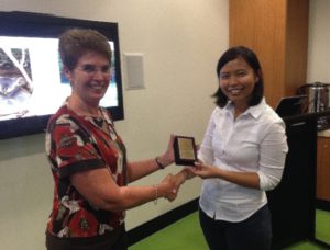 Board Member Professor Kaye Basford presents Sandar with her Fellowship plaque